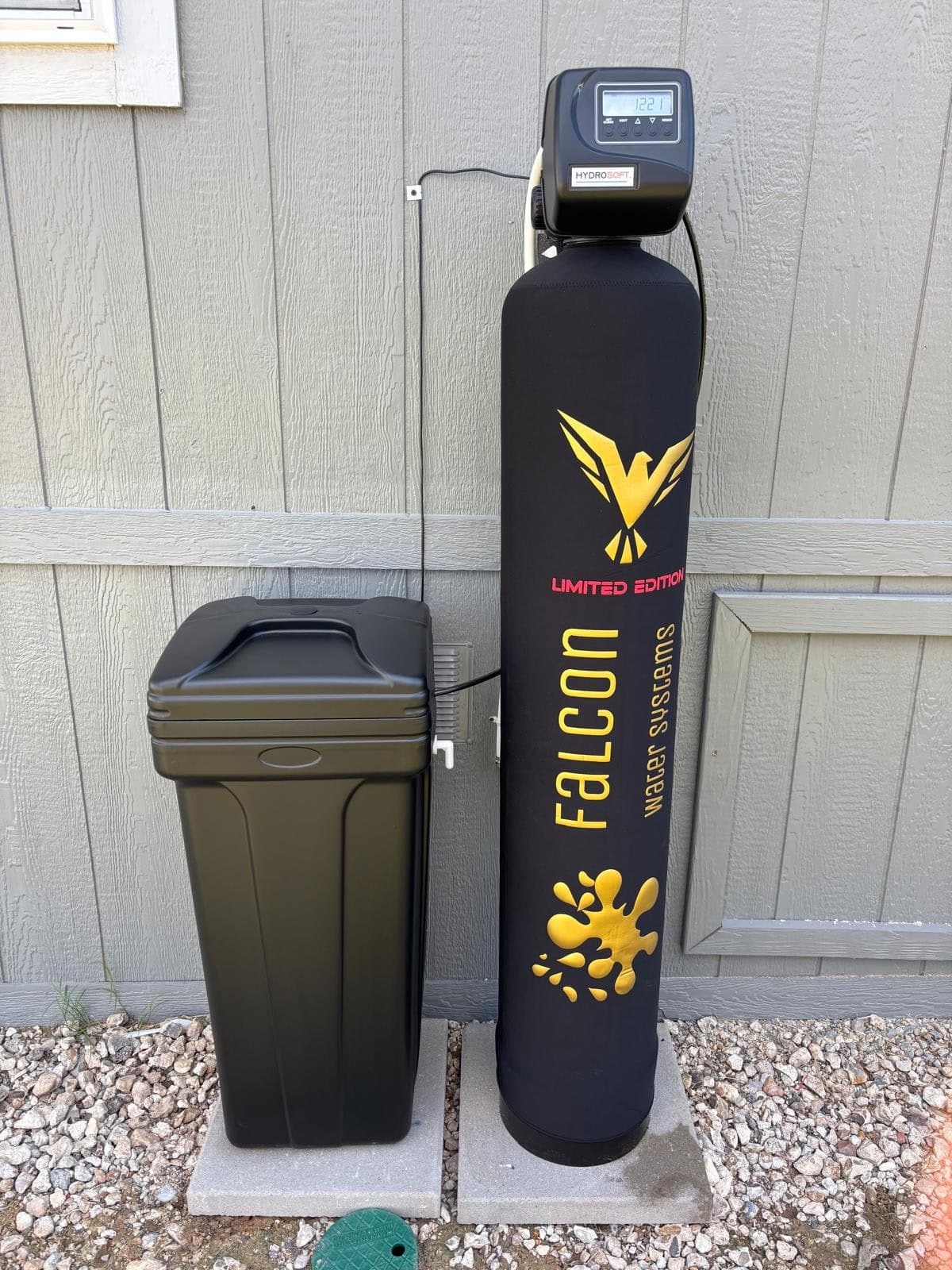 Black and gold Limited Edition Falcon softener installed outside a Houston home